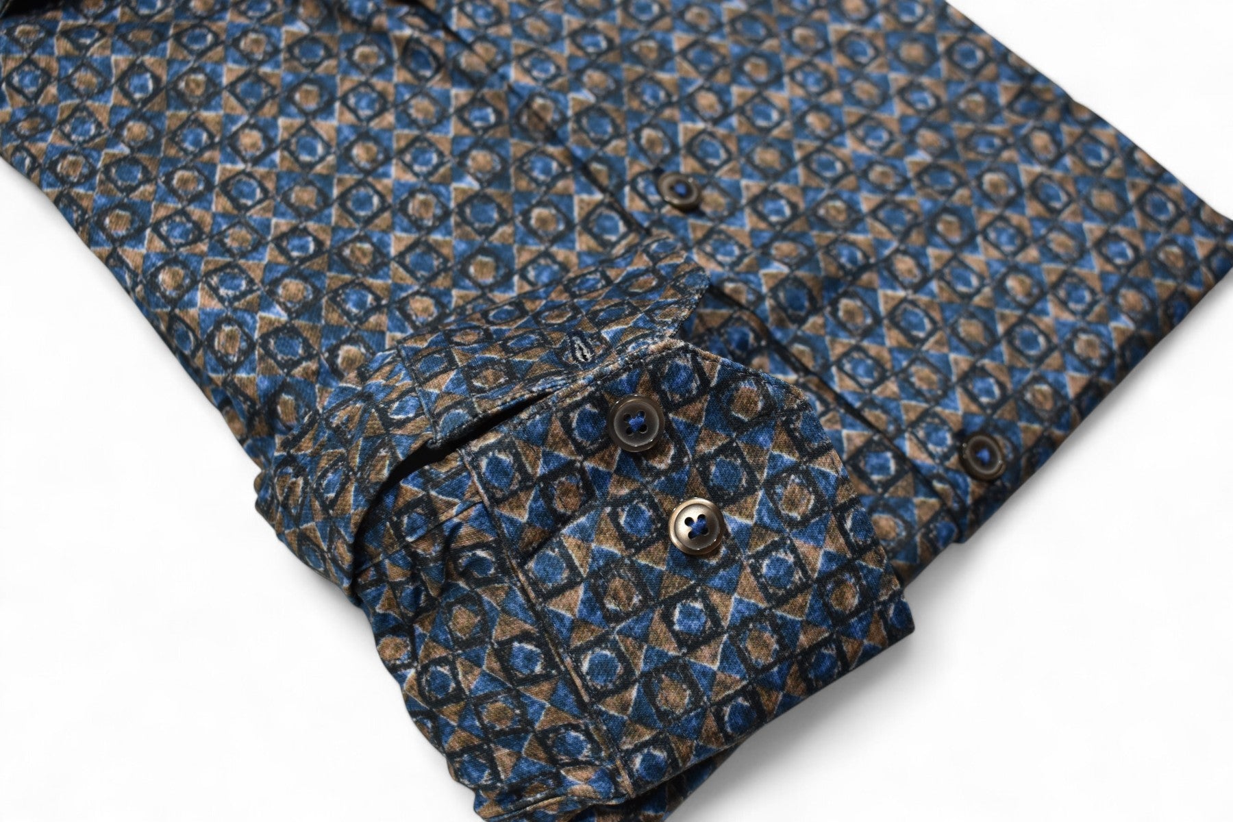 Marcello Mocha Diamond Stretch, where stunning geometric patterns in rich mocha and deep indigo create an eye-catching statement
