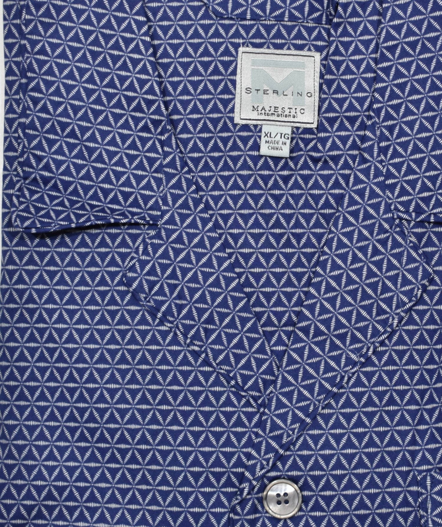 Indulge in luxurious comfort with the ZMJ Navy Triangle Medallion Pajama. Made with soft cotton and featuring a cool jagged diamond like medallion pattern, this classic pajama set offers a relaxed fit and added style with contrast black piping and a drawstring waist. The perfect choice for a good night's sleep.