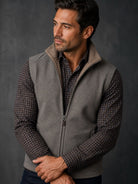 Taupe reverses to camel zip vest.