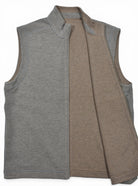 Taupe reverses to camel zip vest.