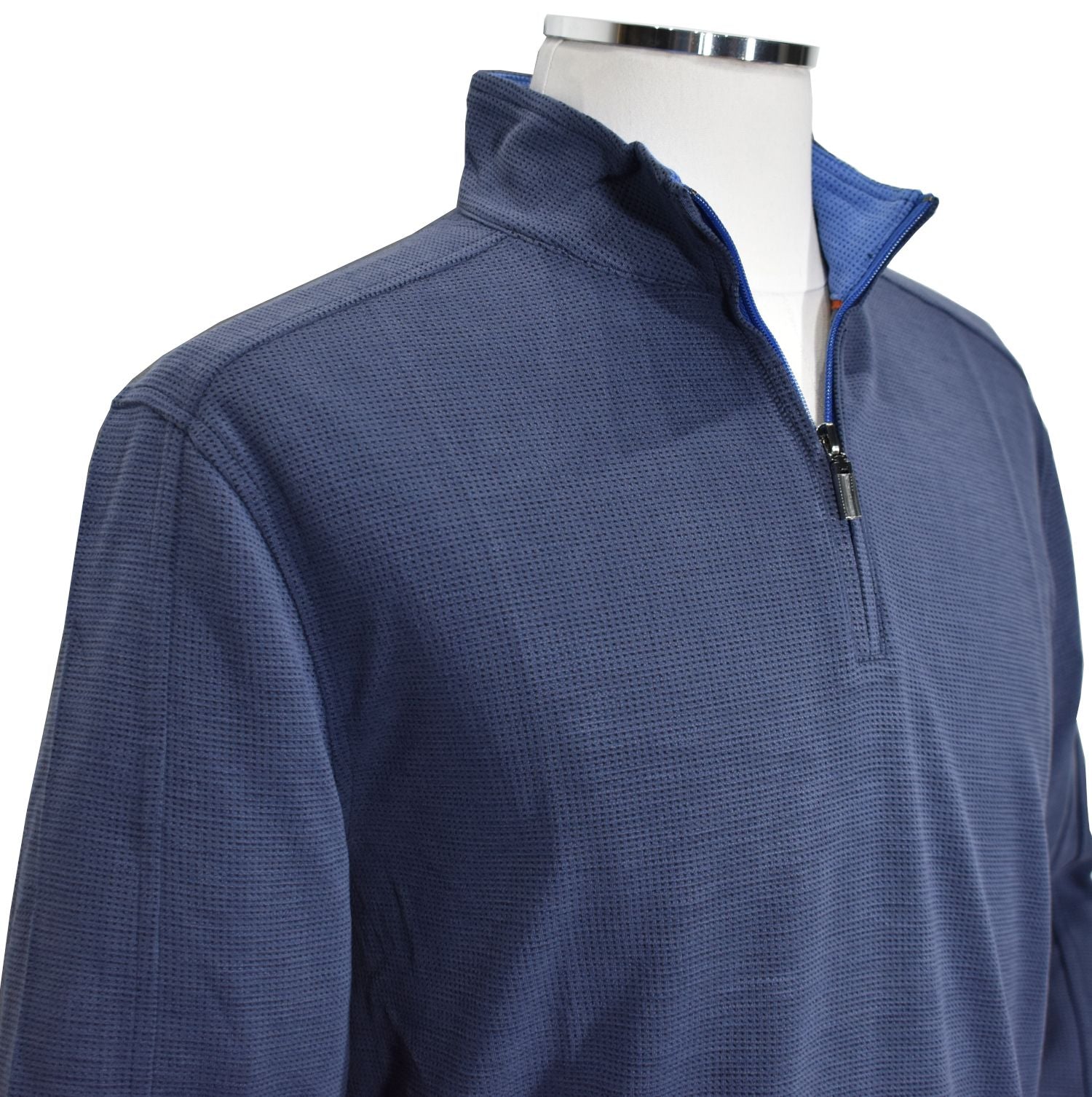 Look sharp in any occasion with this cool 1/4 zip model. Crafted from polynosic fabric, its perfect weight and feel pair perfectly with its waffle weave textured fabric and classic fit. Choose from Red, Navy, and Blue to make a bold statement.  Open sleeve and bottom for a contemporary look with a double track seam running down the shoulder and sleeve.