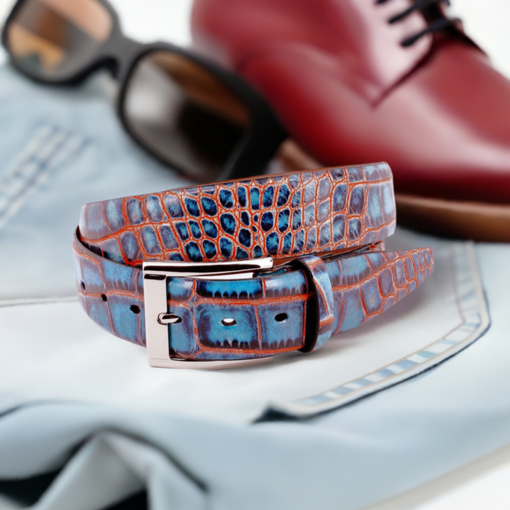 Crafted with impeccable attention to detail, the ZT52907 Italian Embossed Croc Indigo with Red belt exudes sophistication and elegance. Crafted with soft Italian calf leather in a rich chocolate hue, it has been stained with a teal technique for an unforgettable statement tone. Statement silver buckle and a 35mm or 1 7/16" width is the final nuance of this timeless accessory, perfect with any cool jeans.