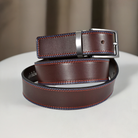 Stand out in style with the B27 Chocolate 2 Stitch Belt. This stylish accessory comes with a classic brown leather base, a trendy 2 color raised stitch in red and royal, and a shiny nickel buckle to complete the look. Perfect for all occasions, you'll be able to choose the perfect size ranging from 32 to 44.  
