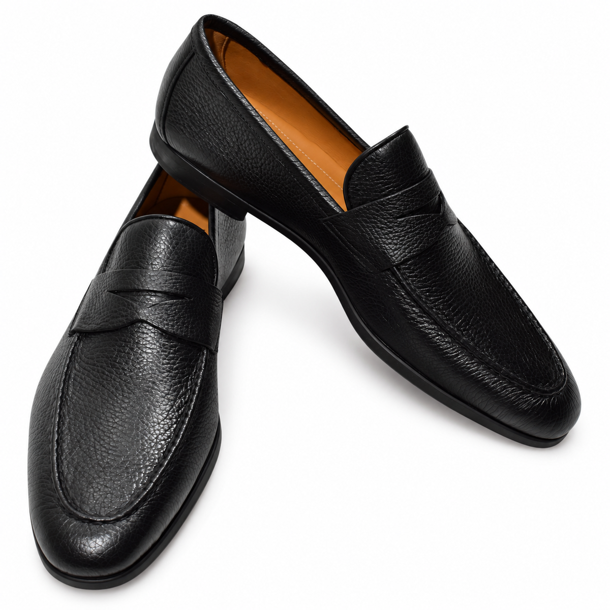 Magnanni Diezma black pebble-grain leather penny loafers with tan lining on a white background.