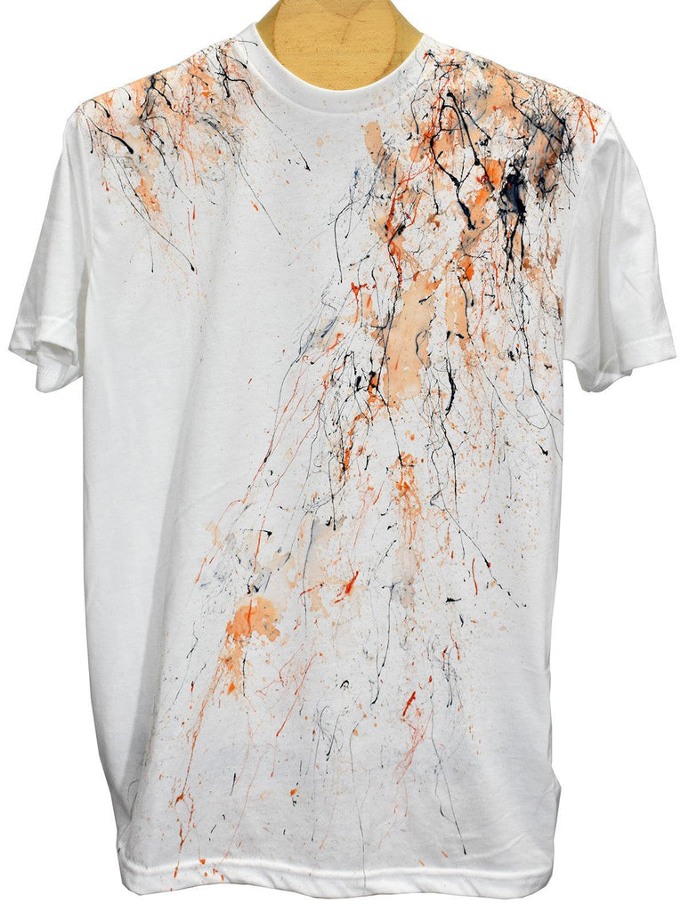 Tee shirts are not just tee shirts anymore. Our hand painted Tees are individually painted by artists making each one a unique piece of art and making them stand out from other tee shirts in quality and style.   White color tee with an orange painted motif.