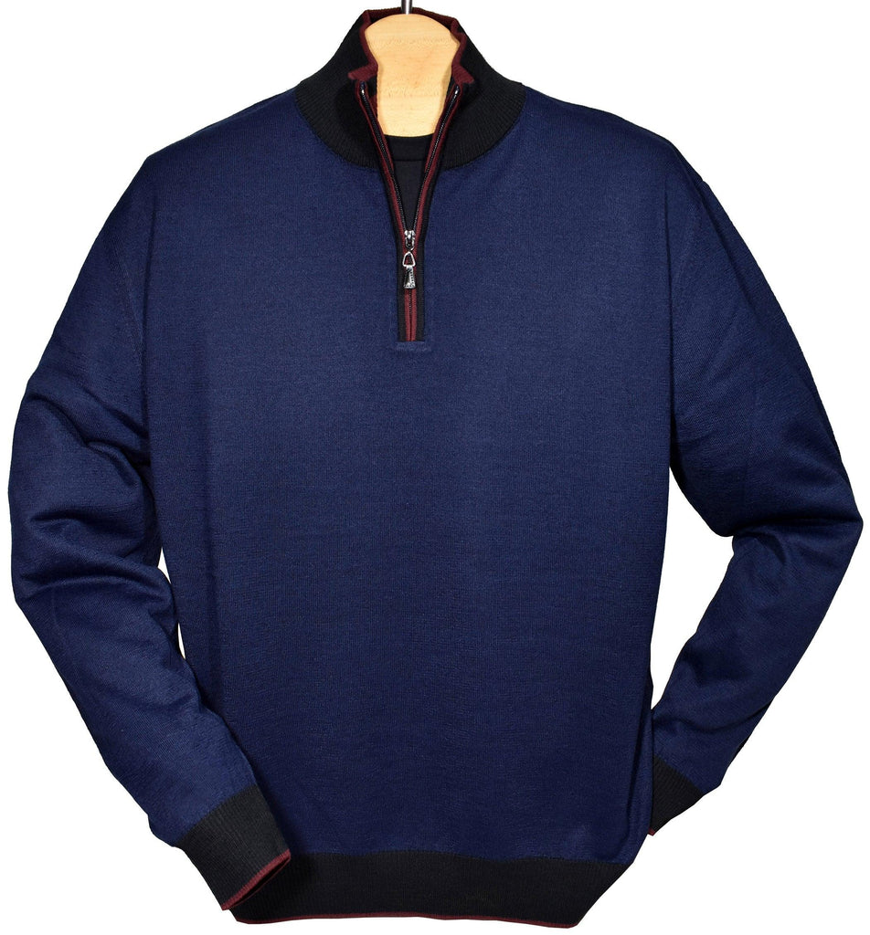 The engineered detailing, along with an outstanding light weight hand feeling, make this one of the finest zip mocks you will find. Available in Navy or Plum. Extra fine, lightweight, merino wool blend. Perfect weight for layering or under a sport coat. Engineered style creates a cool, contemporary image. Classic ribbed cuffs and waist band with contrast colors. Classic fit.