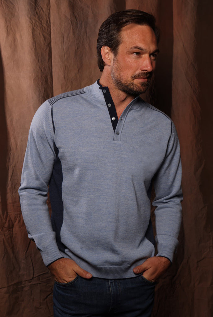 Fashion detailing and contrast colors engineered to balance this button mock in an exclusive updated fashion style.  Created utilizing soft and light weight Italian merino wool blended yarns that can be worn alone or over another shirt. 
