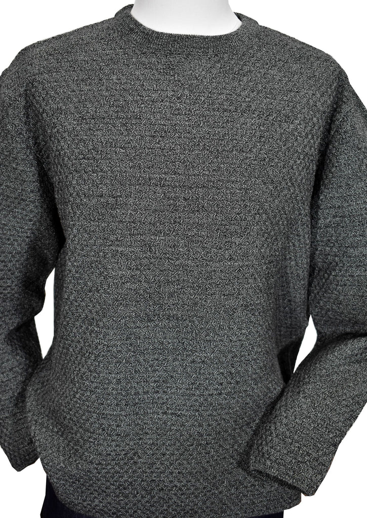 Marcello has a new take on the classic fisherman type knit sweater. The tonal jacquard stitching in mixed charcoal yarns creates an updated look to a classic. Contemporary styling yields the perfect mid weight item for classic or fashion looks.  Open tubular sleeve and bottom.  Extra fine Italian merino wool blended fabric.  Classic fit.