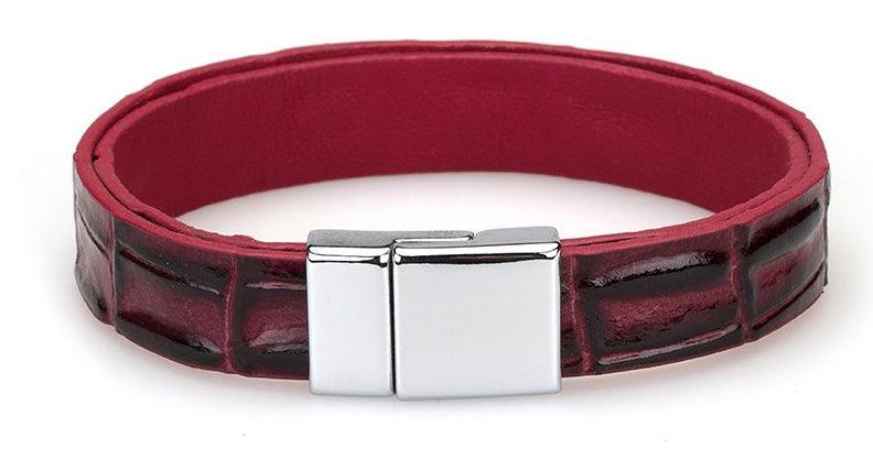 Enhance his style with a crocodile stamped and shaded leather bracelet.    Unique croc stamped pattern. Shaded wine and red coloration. Chrome magnetic closure. One size.