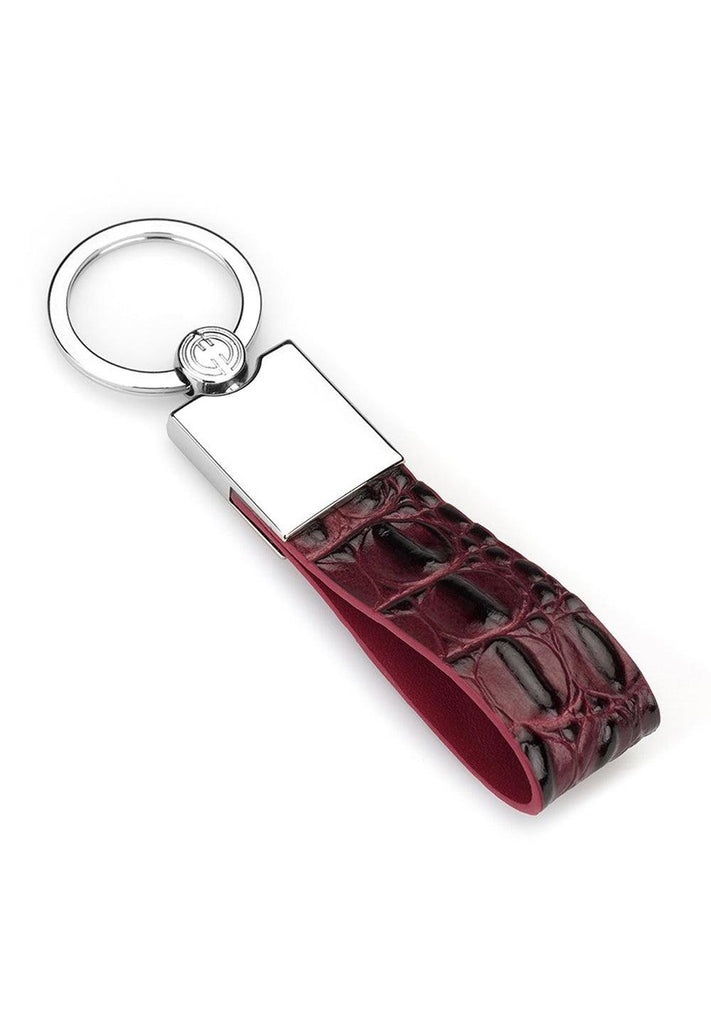 Great gift giving idea for yourself or that individual that has everything.  Leather stamped and shaded croc pattern. Contemporary chrome key attachment. Approximately 3" by 1/2". By Marcello Sport.