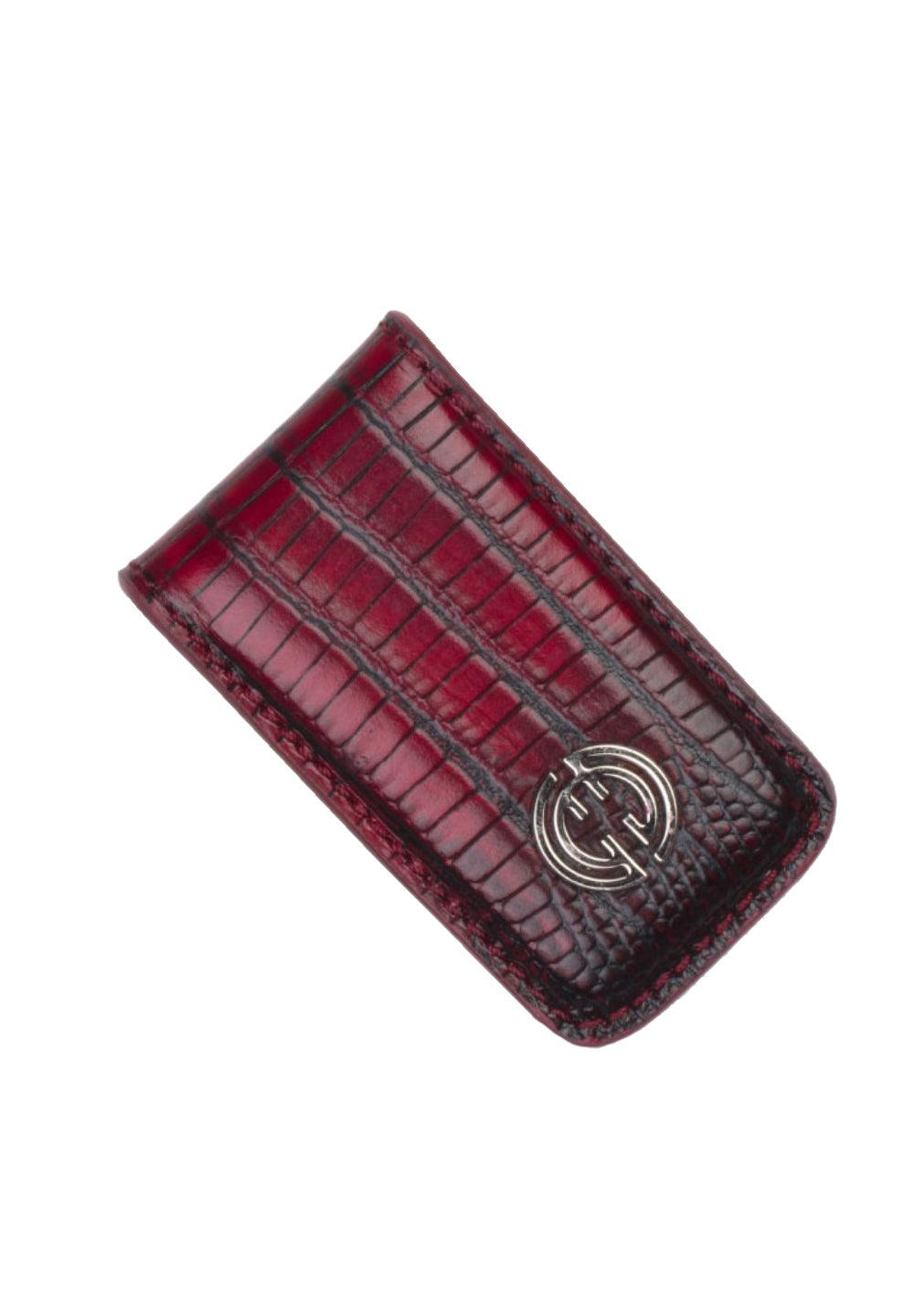 Keep it simple, yet cool, with this soft leather stamped snake pattern.  The leather stamped snake pattern in ruby red is a perfect complement to any bottoms. Genuine leather over metal clamp. Perfect to travel light and keep your valuables in your front pocket.  By Marcello Sport