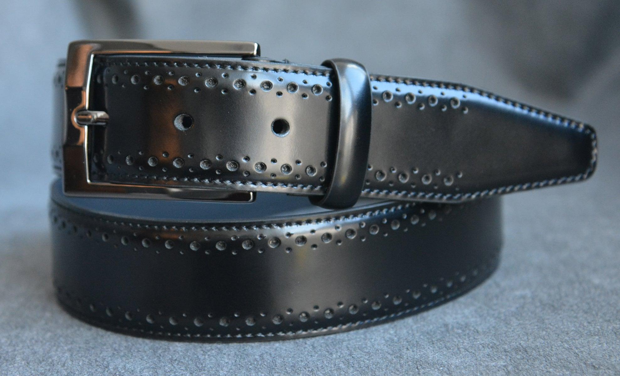 Pants or jeans are perfect for this perforated belt on glove leather. Soft glazed, polished buckle.   Men's edge embossed belt by Marcello Sport in Black.  Italian leather. Satin nickel finished buckle. Perfect look for a dressy style. Available in Black or Cognac. Imported.