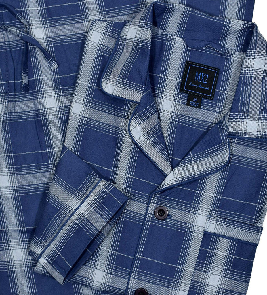 Our exclusive men's pajamas are made with extra fine cotton that is soft to the touch.  The result is a comfortable pajama that enhances you around the house lifestyle.  Soft cotton woven fabric. Traditional fashion pattern. Blue ground with soft grey plaid.