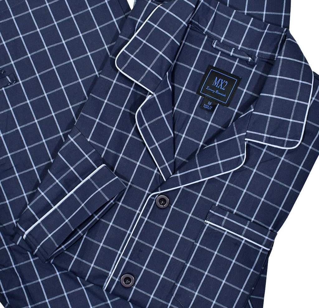 Our exclusive men's pajamas are made with extra fine cotton that is soft to the touch.  The result is a comfortable pajama that enhances you around the house lifestyle.  Soft cotton woven fabric. Traditional fashion pattern. Navy with soft grey window pane.