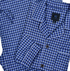 Our exclusive men's pajamas are made with extra fine cotton that is soft to the touch.  The result is a comfortable pajama that enhances you around the house lifestyle.  Soft cotton woven fabric. Traditional fashion pattern. Medium blue plaid with soft grey and charcoal. Classic coat top with pocket, button closure and edge piping.