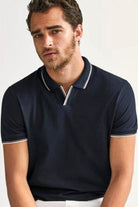 By Marcello Sport.  When your basic polo just won't cut it out on the town or for a date, this stylish polo sports and made of style and sophistication.  Soft cotton pique with a touch of Lycra for stretch comfort. Open collar lays nicely without buttons. Contrast tipping detail on collar, placket and cuffs. Classic fit.