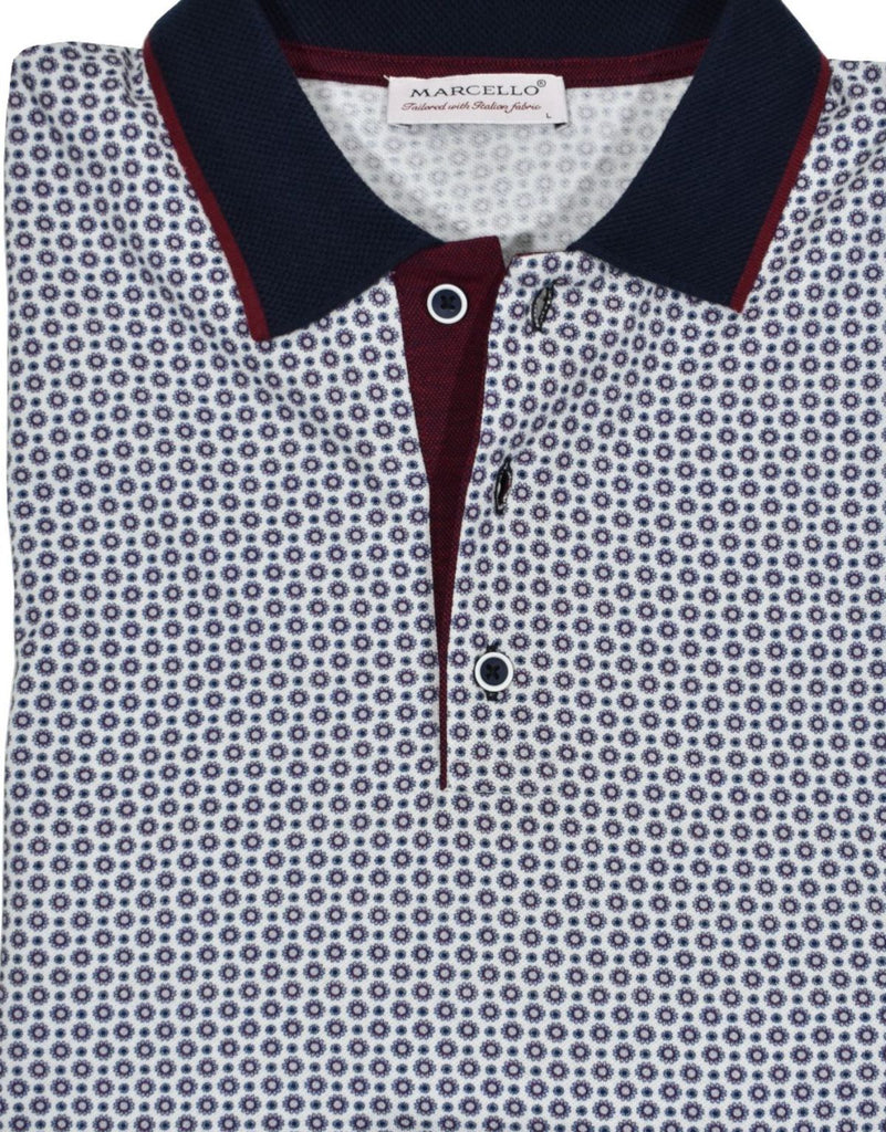A classic white polo with a crisp printed gray and black medallion pattern creates a unique fashion look coupled with a casual or dress image.  Finely knitted pique cotton fabric.  Matched collar, contrast fabric under the buttons and hand selected buttons.  Classic fit.