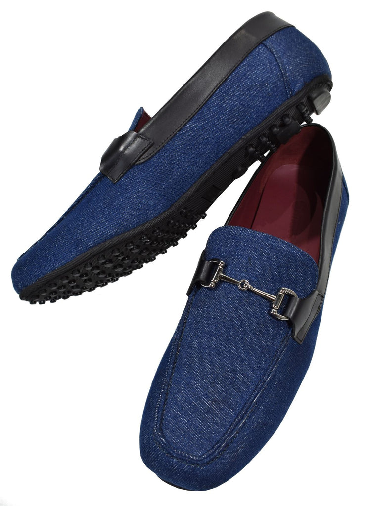Send a fashion statement that is truly unique with our trend moccasin in denim blue fabric with leather trim and a sport rubber sole. The shoe fabric is denim jean fabric a gun metal accessory and comfort sole.  Classic fit, whole sizes only.  Designed and hand crafted in Spain. Shoe by Marcello.