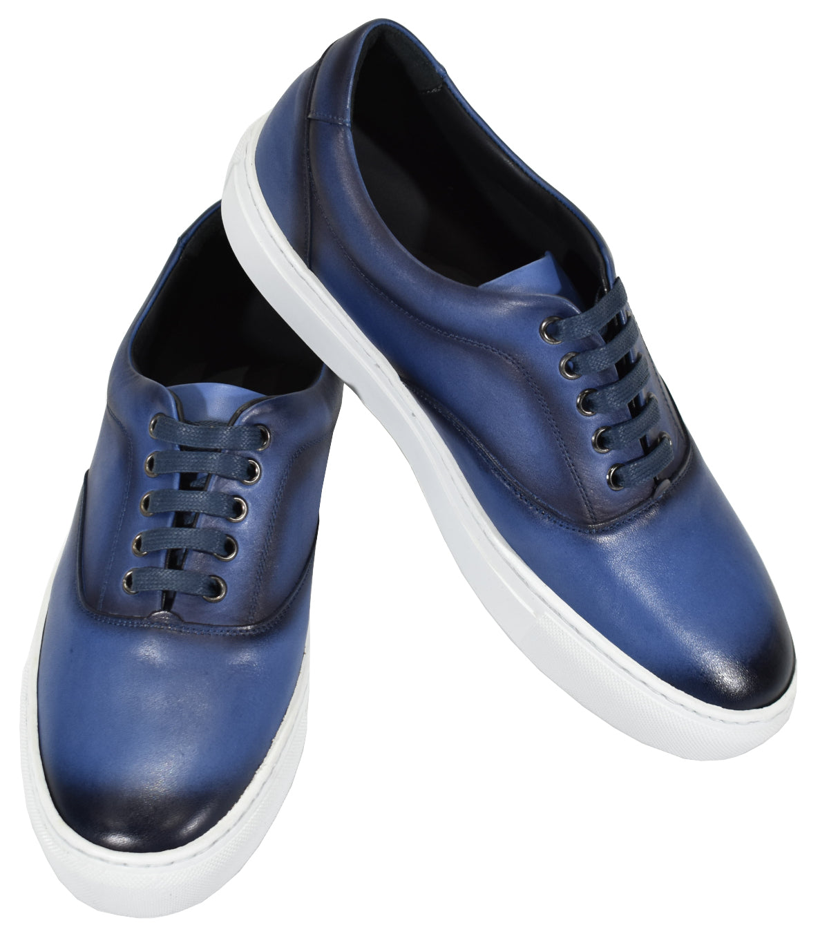 Classic men's sneaker, with a fashion leather upper, has never been more popular than now. Medium sole height, soft cushion insole for added comfort.  Simple clean design is both sleek and casual, perfect for everyday wear and sets a contemporary image.  Designed and manufactured in Spain.  Classic fit. Indigo leather sneaker by Marcello.
