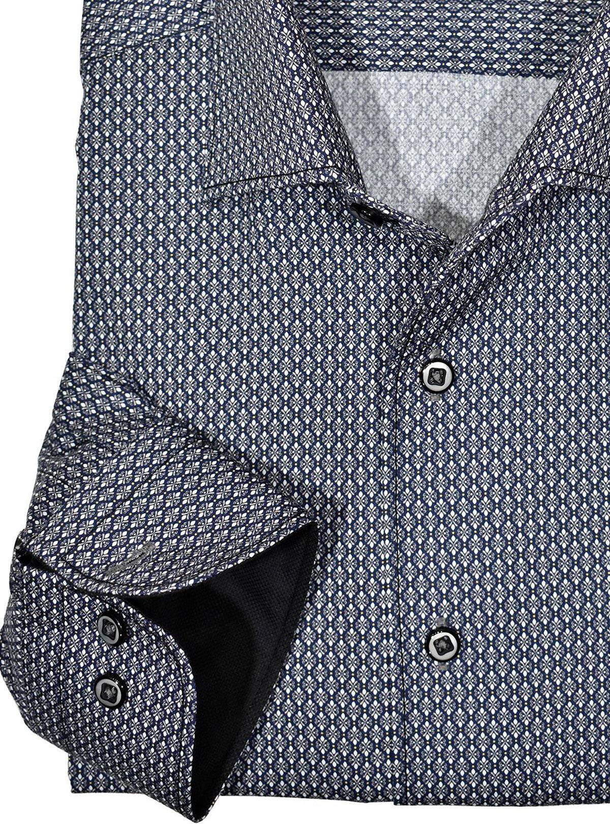 Marcello exclusive 1 piece roll collar shirt is the ultimate in style and sophistication.  The one piece collar stands perfectly and looks great alone or under a sport coat.  You will surely want every one piece roll collar shirt we offer.  Rich cotton / microfiber fabric. Fashion tall oval medallion pattern in striking grey/black colors. Adjustable 2 button cuffs. Unique extra sleeve button to roll cuffs without flaring. Classic shaped fit.