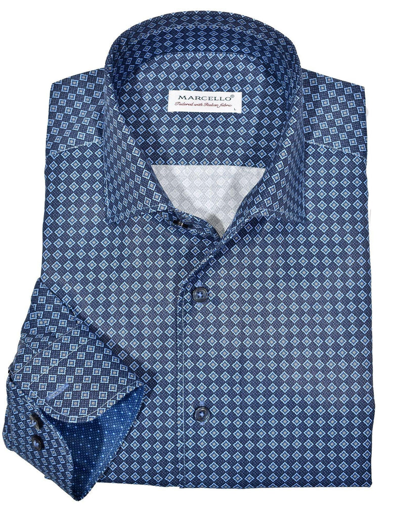 Marcello exclusive 1 piece roll collar shirt is the ultimate in style and sophistication.  The one piece collar stands perfectly and looks great alone or under a sport coat.  You will surely want every one piece roll collar shirt we offer.  Rich cotton / microfiber fabric. Fashion diamond medallion pattern in rich blue colors. Adjustable 2 button cuffs. Unique extra sleeve button to roll cuffs without flaring. Slim fit. Shirt by Marcello Sport
