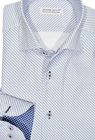 Exclusive Marcello 1 Piece Roll Collar Shirt.  The one piece roll collar stands perfectly and looks fantastic alone or under a sport coat.  The two color blue diamond pattern coupled with a rich fabric creates a sophisticated look to set you apart from the rest.  Hand selected buttons, two button cuff placket for the best look when rolling up the cuffs and enhanced stitch detailing.  Classic shaped fit.