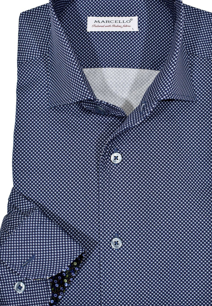 Exclusive Marcello 1 Piece Roll Collar Shirt.  The one piece roll collar stands perfectly and looks fantastic alone or under a sport coat.  The classic navy with sky dot pattern coupled with a rich fabric creates a sophisticated look to set your apart from the rest.  Hand selected buttons, two button cuff placket for the best look when rolling up the cuffs and enhanced stitch detailing.  Classic shaped fit.