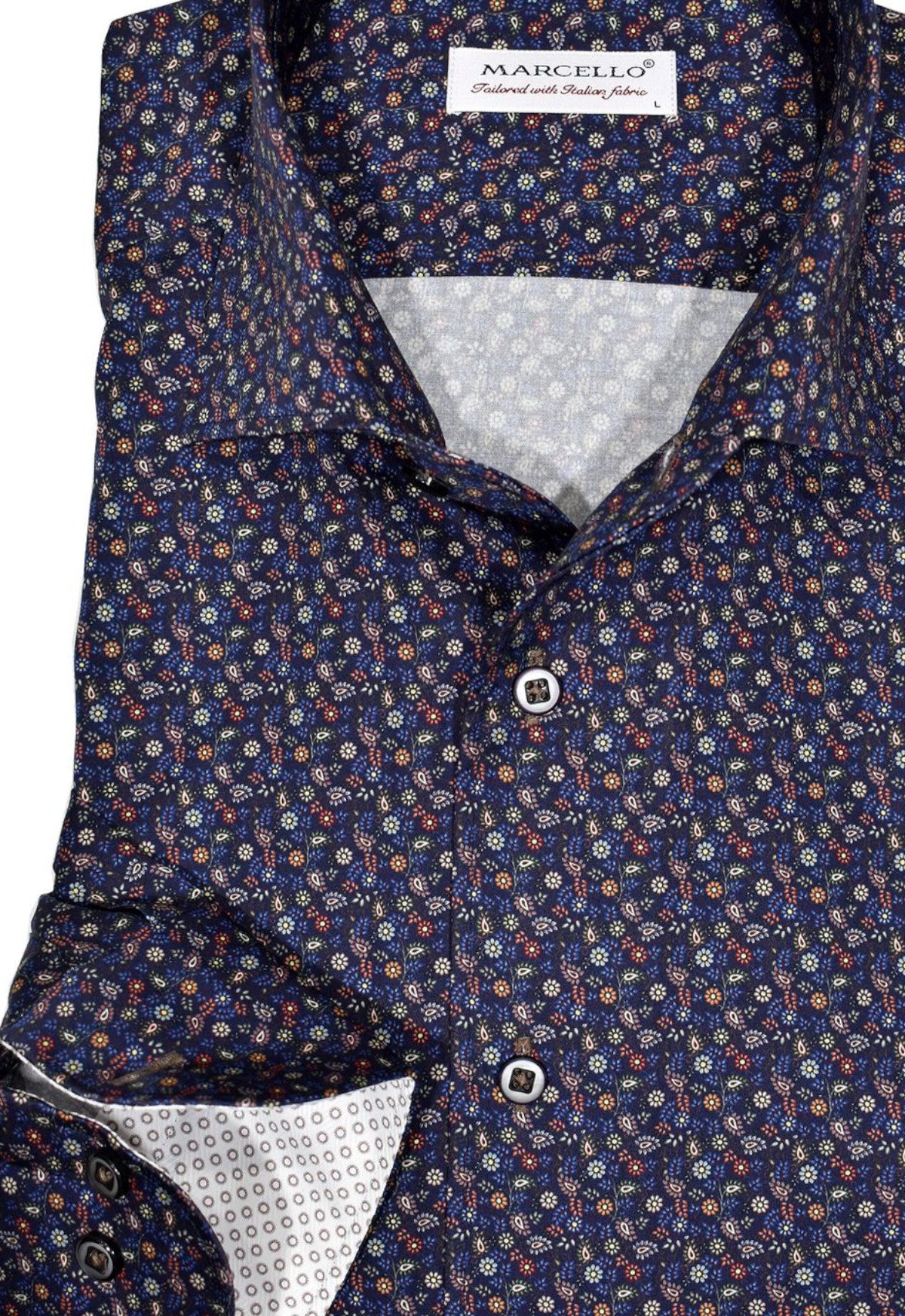 Exclusive Marcello 1 Piece Roll Collar Shirt.  The one piece roll collar stands perfectly and looks fantastic alone or under a sport coat.  The multi navy paisley pattern coupled with a rich fabric creates a sophisticated look to set your apart from the rest.  Hand selected buttons, two button cuff placket for the best look when rolling up the cuffs and enhanced stitch detailing.  Classic shaped fit.