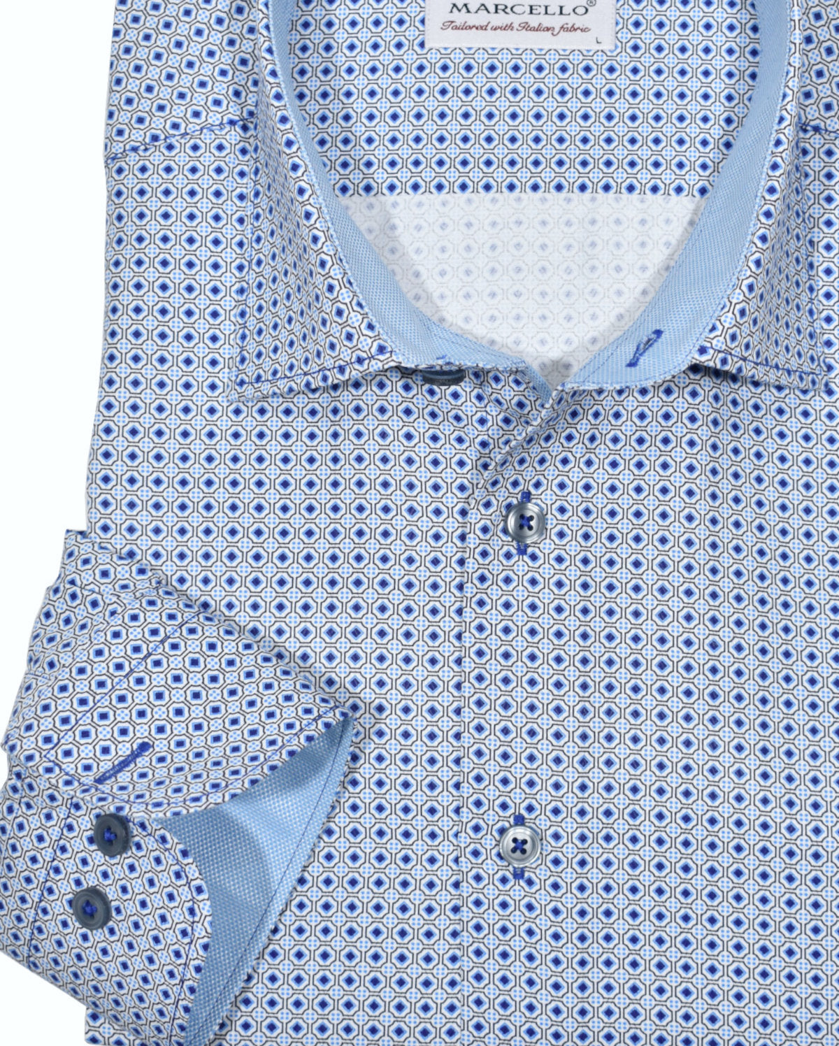 Fine pique cotton fabric with a classic geometric medallion print. White ground shirt with classic navy colors and a hint of teal accents.  Contrast stitching.  Medium collar.
