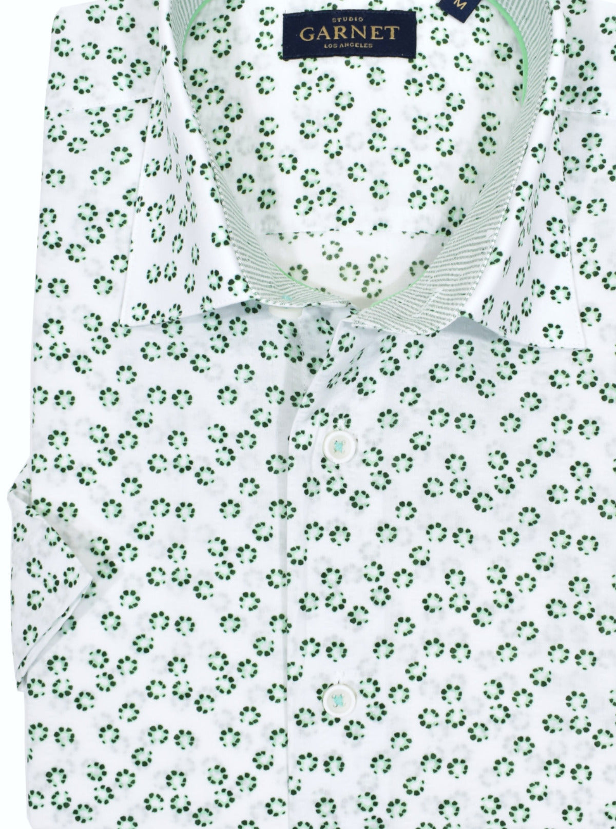 Cotton fabric with a seersucker finish sporting a random petal pattern that gives off a contemporary sporty feel.  Soft washed, contrast trim fabric and matched buttons add to the look.  Classic shaped fit.