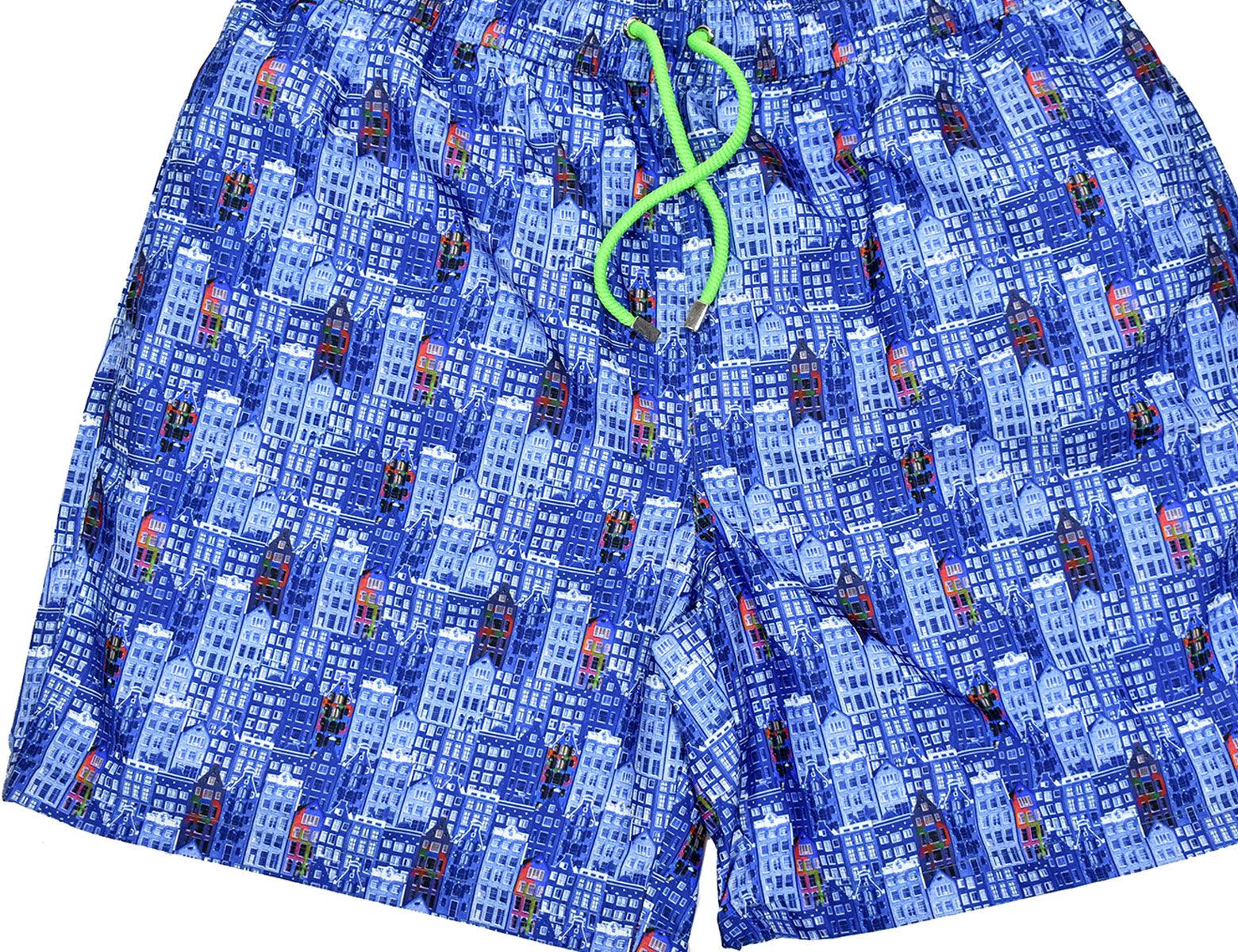 Our cool microfiber fabric swim shorts feature a unique pattern sure to set your image at the pool or beach.  Classic quick dry fabric. Elastic stretch waist band with fashion draw strings. Side slash pockets and back pocket. Mesh lining. Modern fit, order up one size if between sizes. Buildings print swim suit, by Marcello Sport.