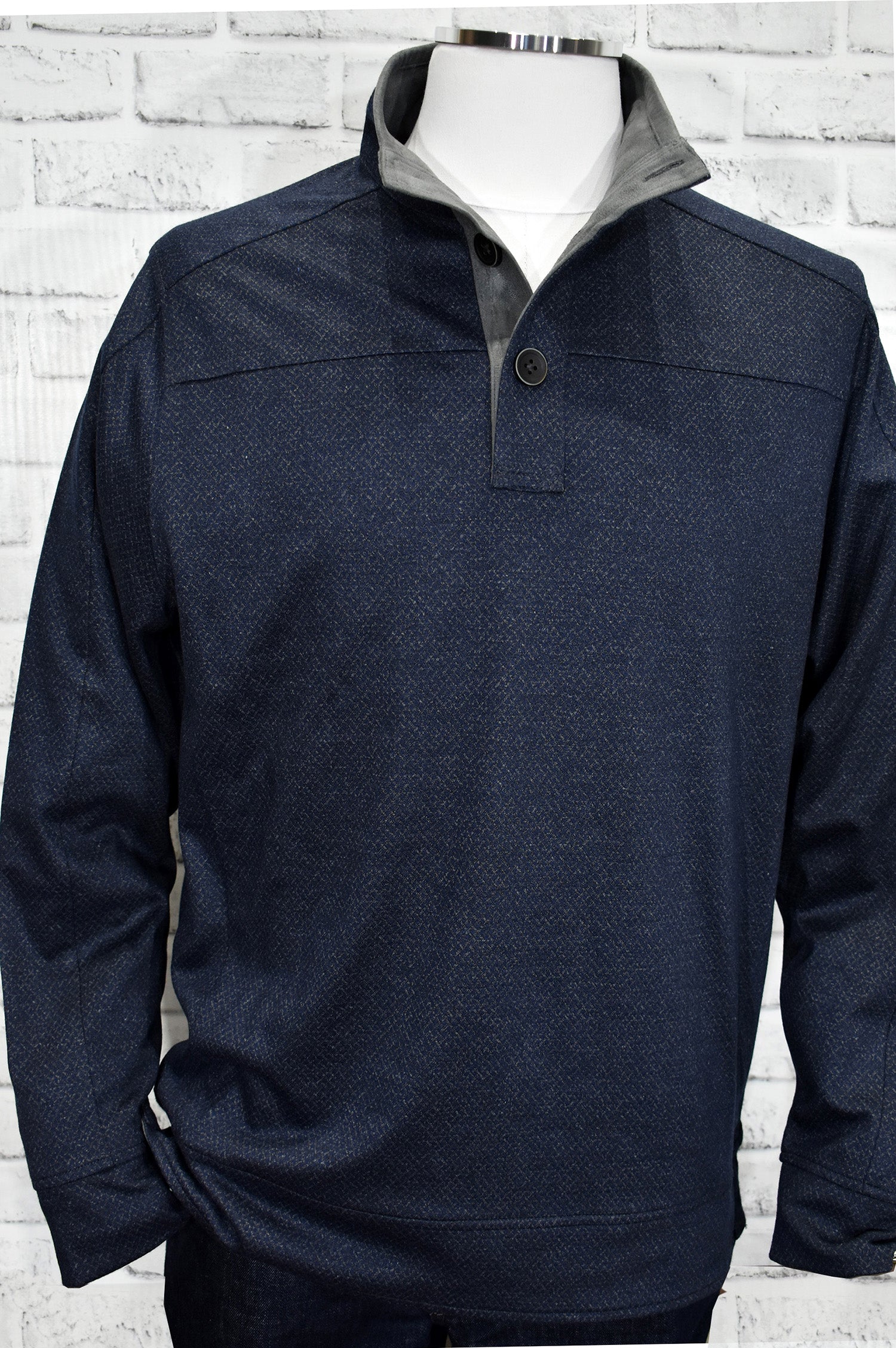 A classic mock neck in cotton microfiber fabric with a fine diamond pattern in soft gray over a navy ground.  The performance fabric is great for any event and traveling.  Add style to this basic mock with suede trim in the neck and along the button placket.    Open sleeves and open bottom for a cool contemporary style.  Light weight.  Classic fit.