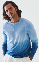 The ultimate in comfort and softness, this long sleeve cotton henly model sports a fine contemporary style.  The soft blue combined with darker blues are washed for a soft, cool look. Soft pima cotton. Designed by Assaraf Italy. Button closure henly type collar. Open sleeves and bottom. Modern fit, perfect for a slim to medium build.