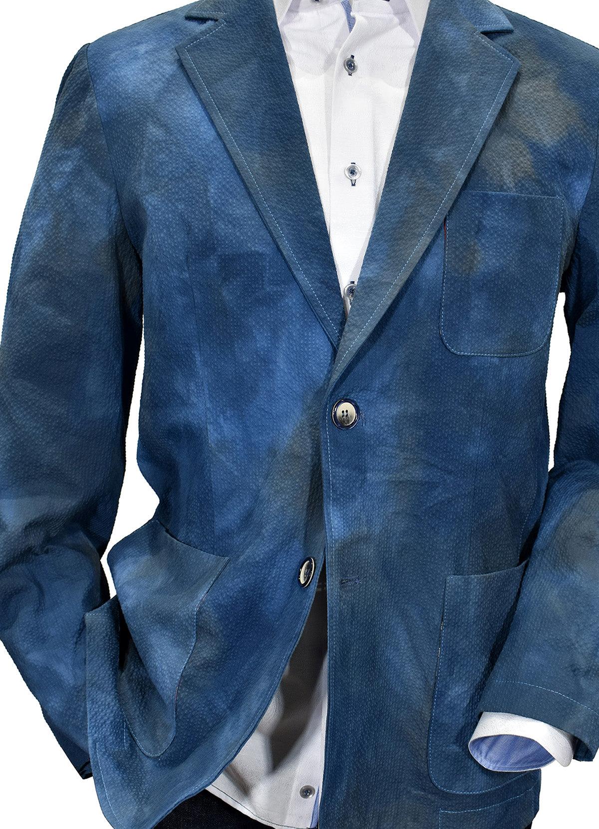 When your image makes a statement, it surely will be when wearing this textured washed and dyed sport coat. Uniquely designed and produced by Graison in Italy featuring a soft shadow seersucker fabric, washed for a distressed, cool image.  Graison Graham Inspired Italian Sport Coat  Excellent with jeans or pants. Fine textured fabric adds to the image. Nice mix of blue and navy washed colors. Soft coat, should lined. Modern fit, best for a slim to medium build.