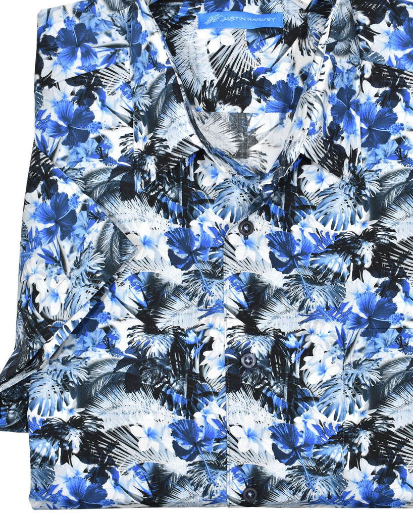 Relax in this tropical pattern! Pattern matched pocket, square bottom, short sleeve, exclusive cotton and classic full cut fit.  Justin Harvey Indigo Palm  100% extra soft cotton. Perfectly matched left chest pocket. Soft coloration. Perfectly matched custom buttons. Square bottom with side slits.