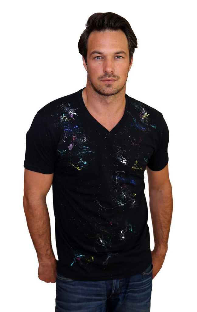 Exclusive Hand Painted Tee in Black or White  Fashion colors and extremely soft Hand Painted Every shirt is unique Contemporary sizing, order one size up if between sizes or prefer a loose fit. Washer / dryer cleaning on delicate cycle with mild detergent.